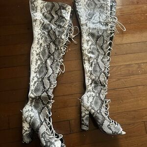 Worn ONCE..size 7 woman 
Full white & Black snakeskin knee high boots